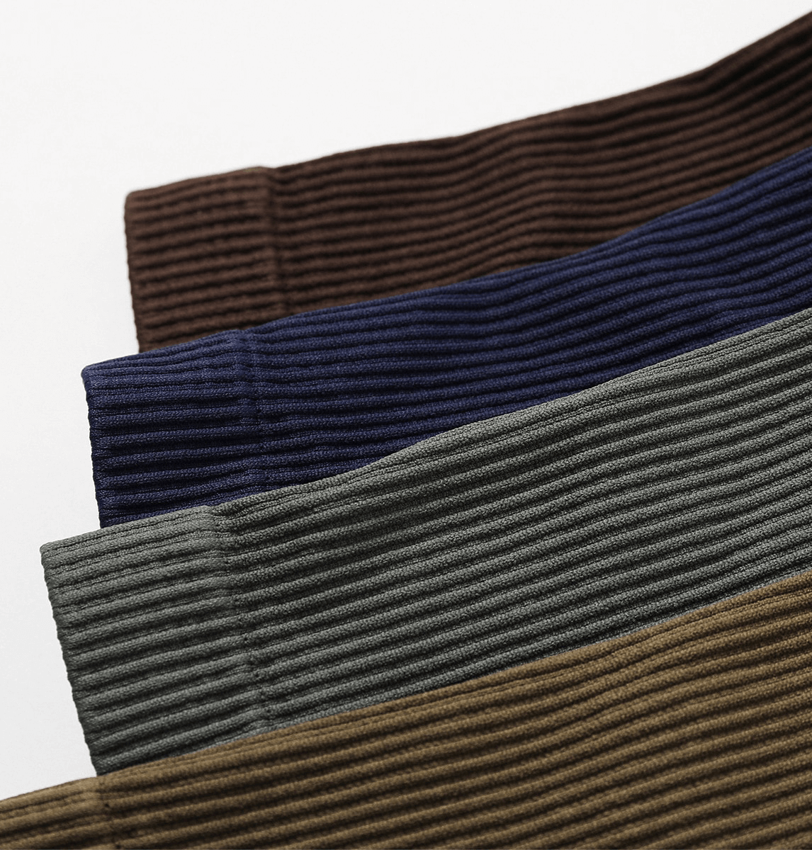 Close-up of fabric swatches in brown, navy, gray, and khaki shades, showcasing ribbed textile texture suitable for yoga suits.